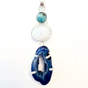 2 1/2 inch, Agate Geode slice and Rainbow Moonstone pendant on a silver chain.